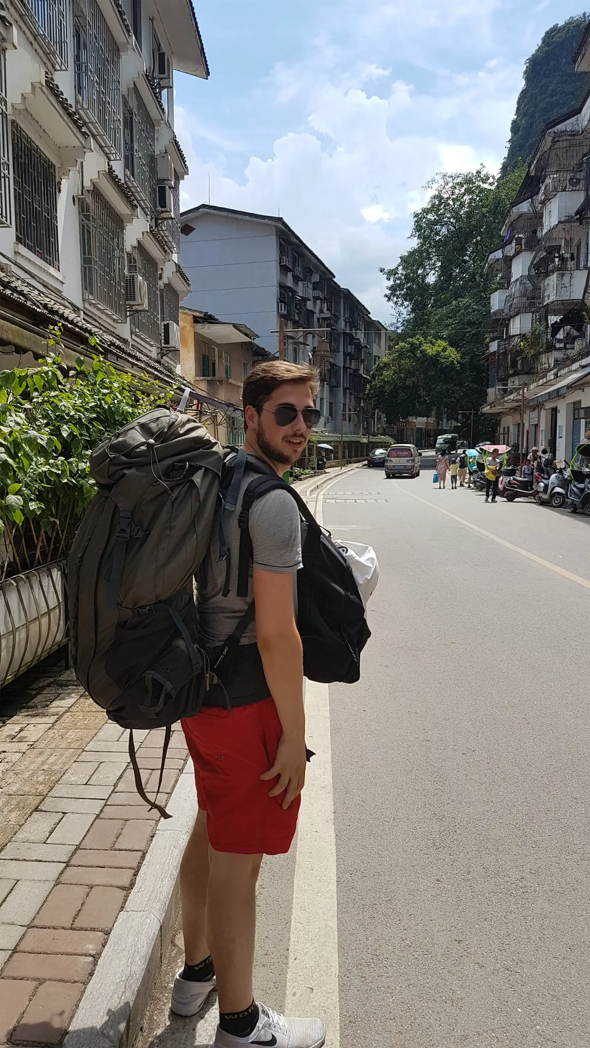 Piotr van Rijssel with backpacks on the street.